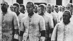 Internees at Dachau camp line up for work.