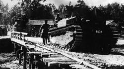 Japanese Type 89 medium tanks, each fitted with 57mm main guns and two machine guns, cross a makeshift bridge during manoeuvres just prior to the Japanese invasion of Malaya. 