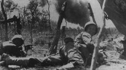 Marines push on towards a Japanese oil dump on Saipan.