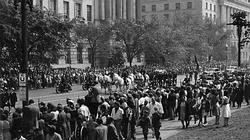 Crowds of Americans watch President Roosevelts funeral procession.