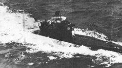 A U-Boat displays the black flag of surrender to an allied plane off the coast of Scotland.