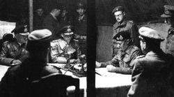 At Luneburg Heath on the 4th May 1945, Montgomery reads the surrender terms for German troops in the west to Admirals Wagner and Friedburg.